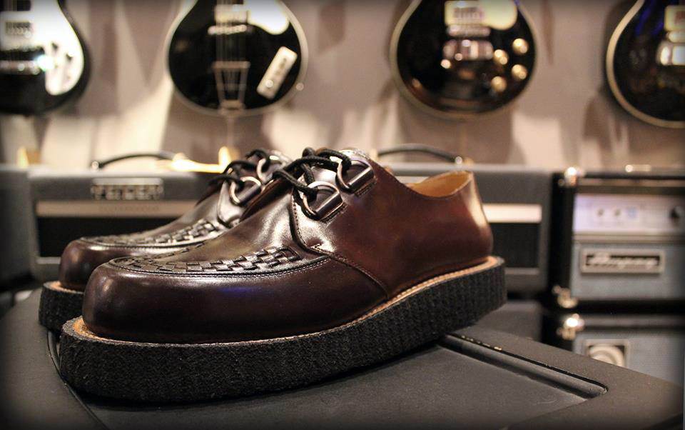 Made-to-Measure Creepers photographed in a guitar shop