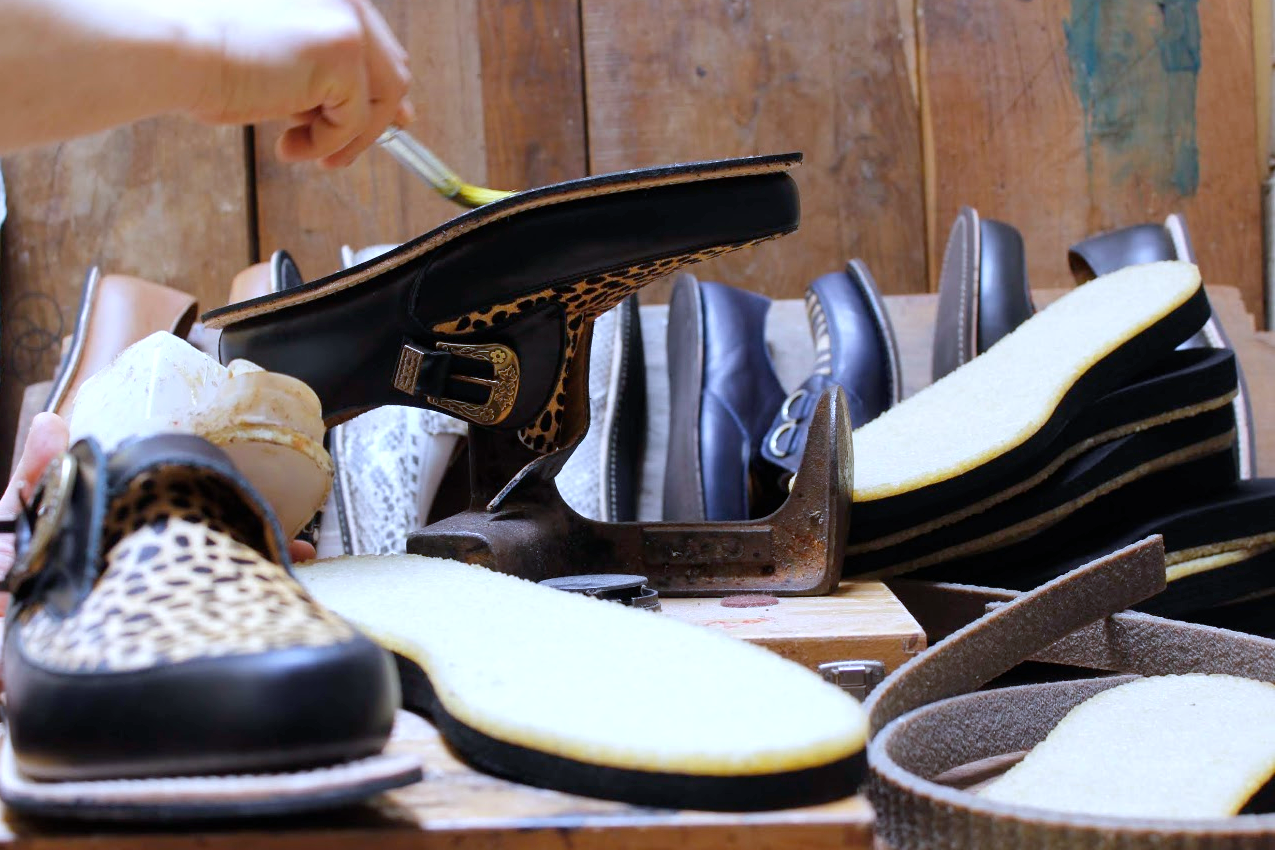 Natural crepe soles and handmade creepers during sole construction in the workshop