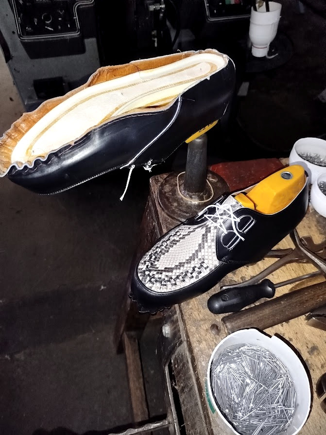 Round Made to Measure creeper with python leather during the lasting process