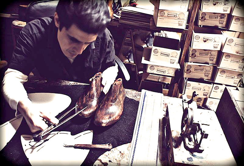 David working with a shoe last in his workshop