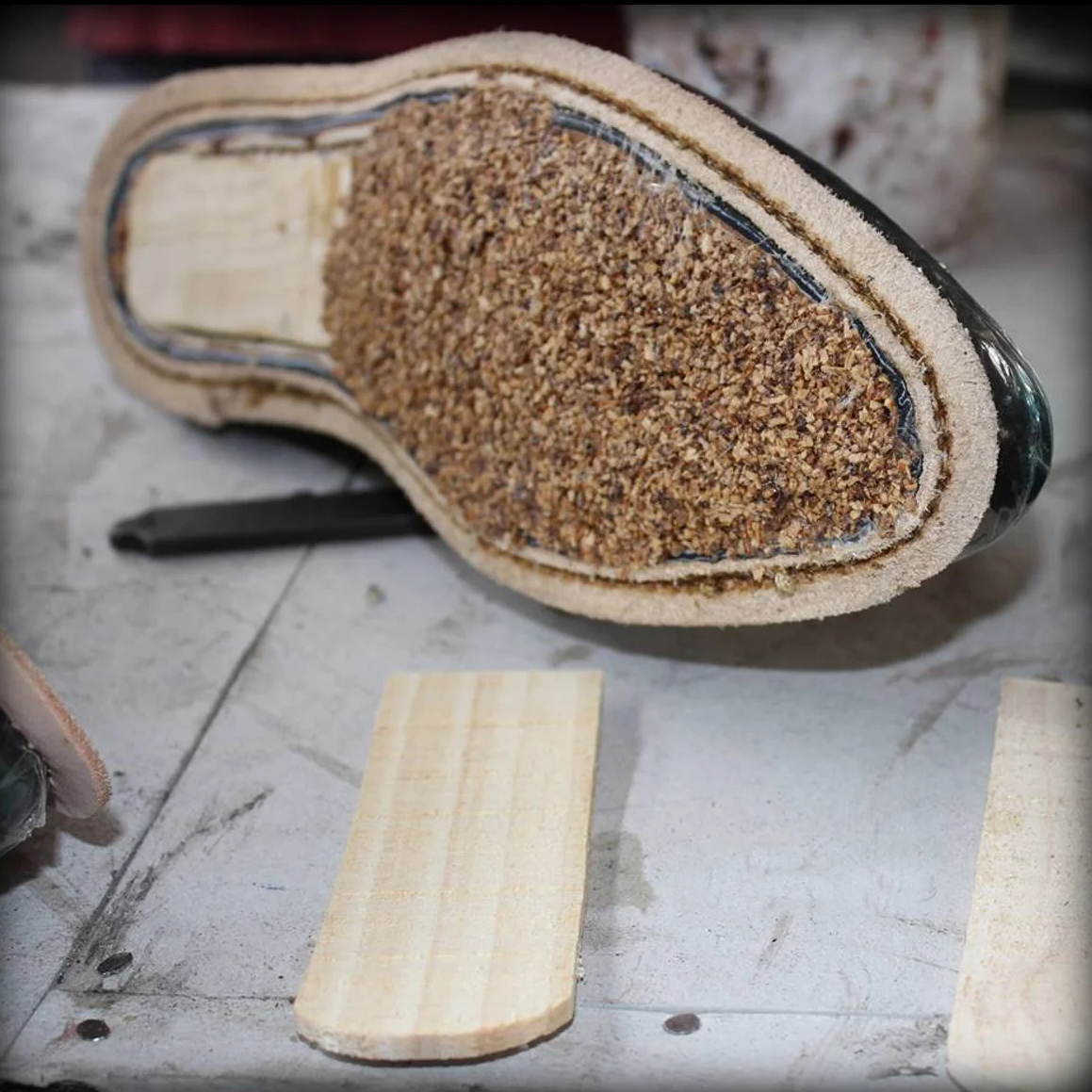 Cork filler and cedar shank inside a Goodyear welted creeper before the outsole is fitted
