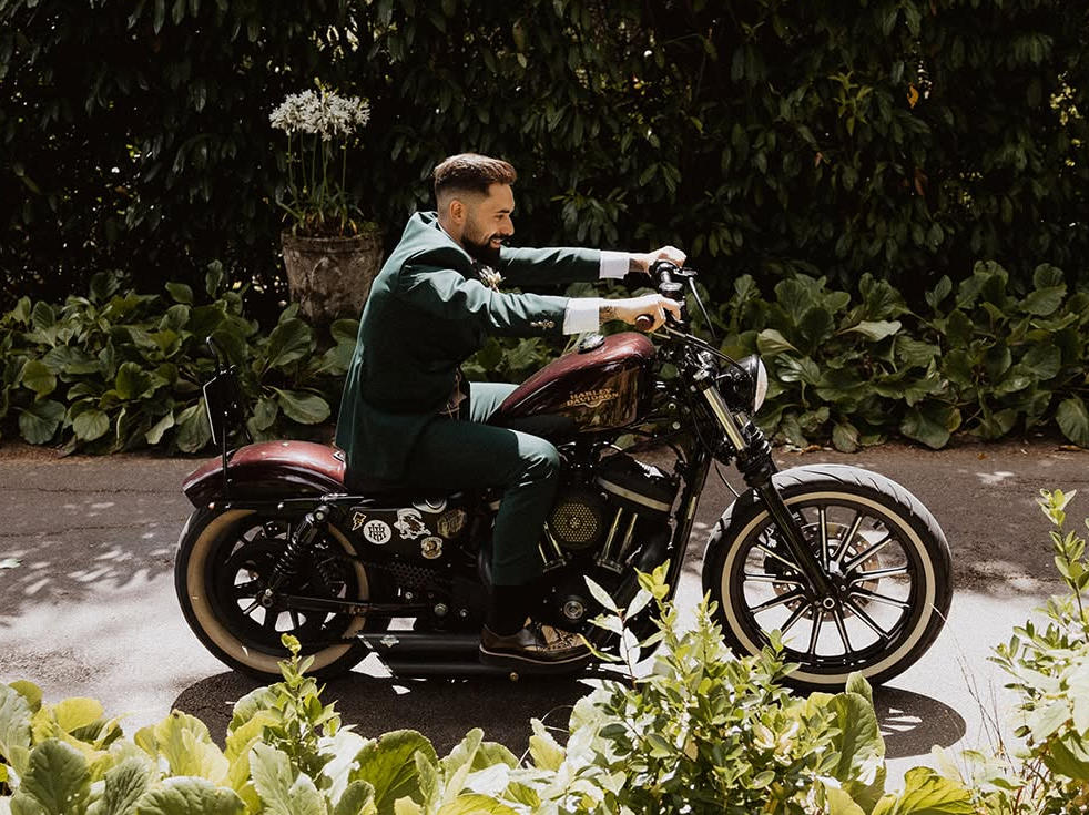 Pablo arriving at his wedding on a motorcycle wearing custom pointed creepers